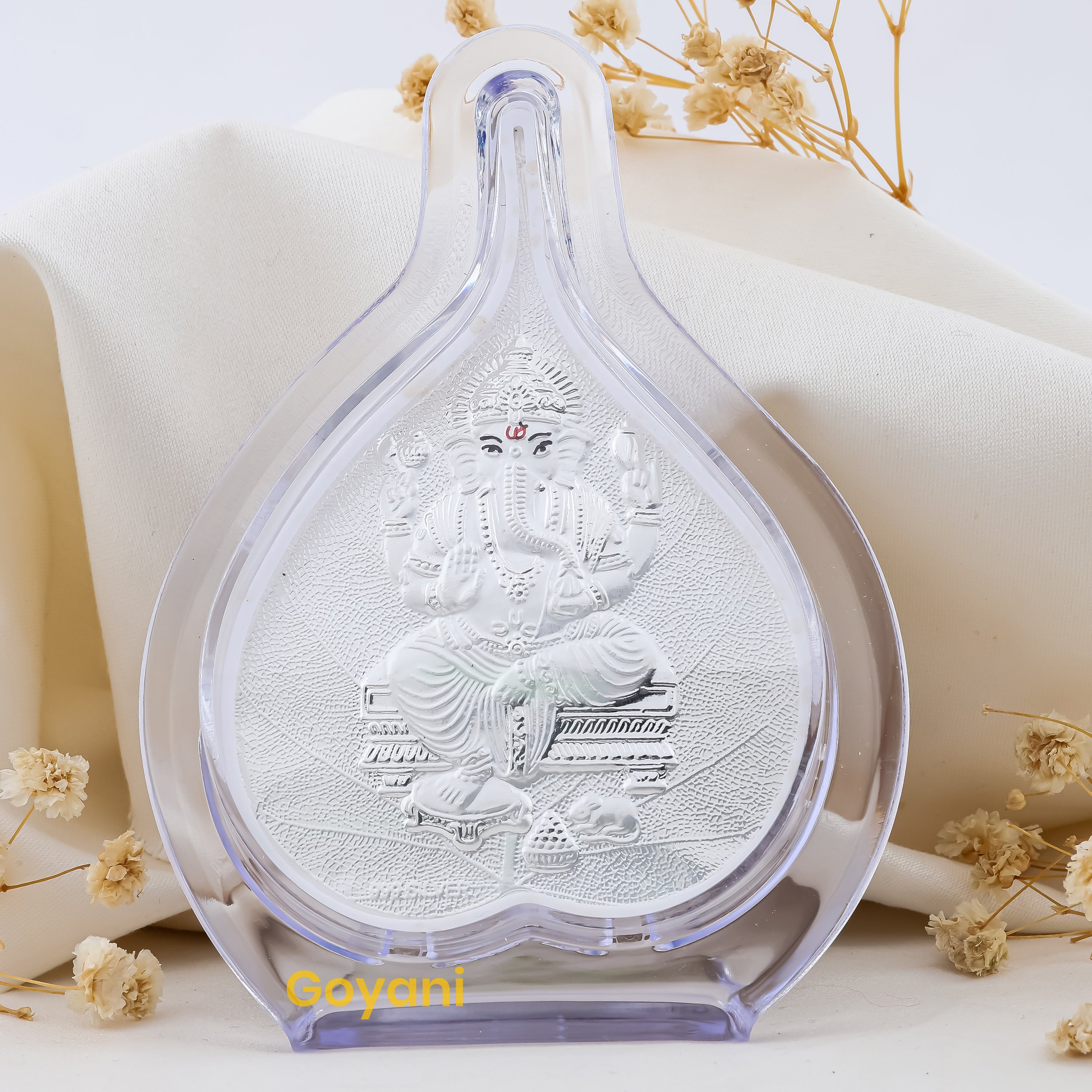 Front view of a 999 pure silver Ganesha Pan Stand showing Lord Ganesha seated on a high-polished pan leaf.