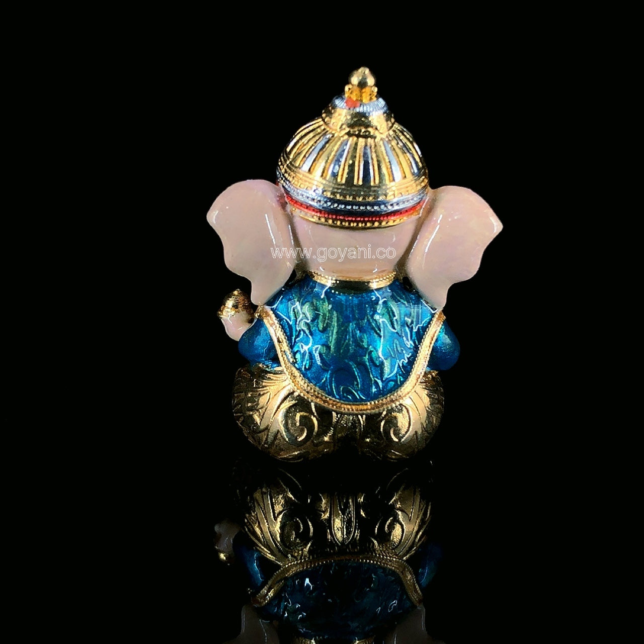 A close-up of the handcrafted 925 silver Baal Ganesha idol, showcasing the intricate Meenakari detail on the face.