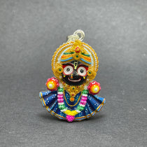 Angled side view of the handmade 925 silver Jagannath pendant, highlighting its polished silver finish.