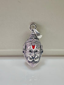 Close-up detail of the 925 sterling silver Hanumanji pendant highlighting the antique oxidised finish on the face.