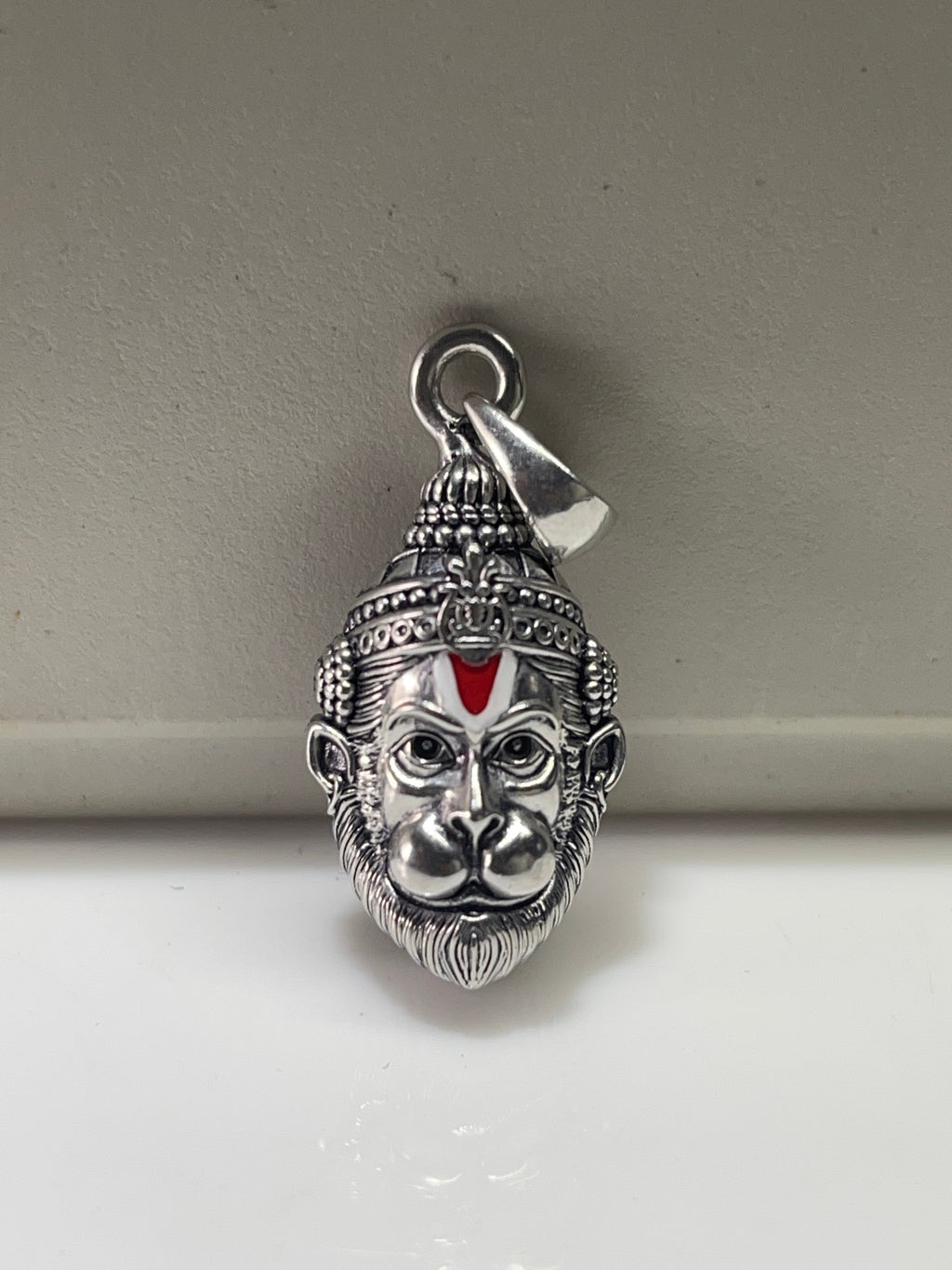Front view of the intricately detailed 925 oxidised silver Hanumanji face pendant, showcasing its divine craftsmanship.