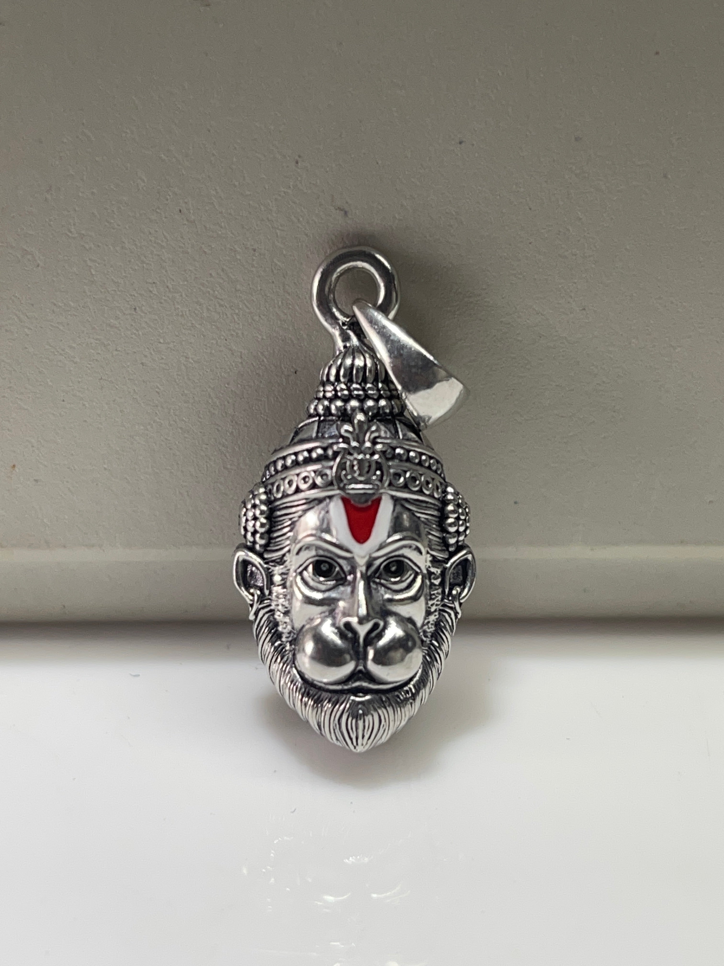 Front view of the intricately detailed 925 oxidised silver Hanumanji face pendant, showcasing its divine craftsmanship.