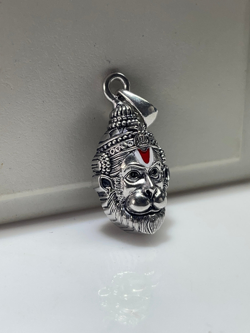 Side profile of the lightweight 925 silver Hanumanji pendant, showing its depth and the hollow backside for comfort.