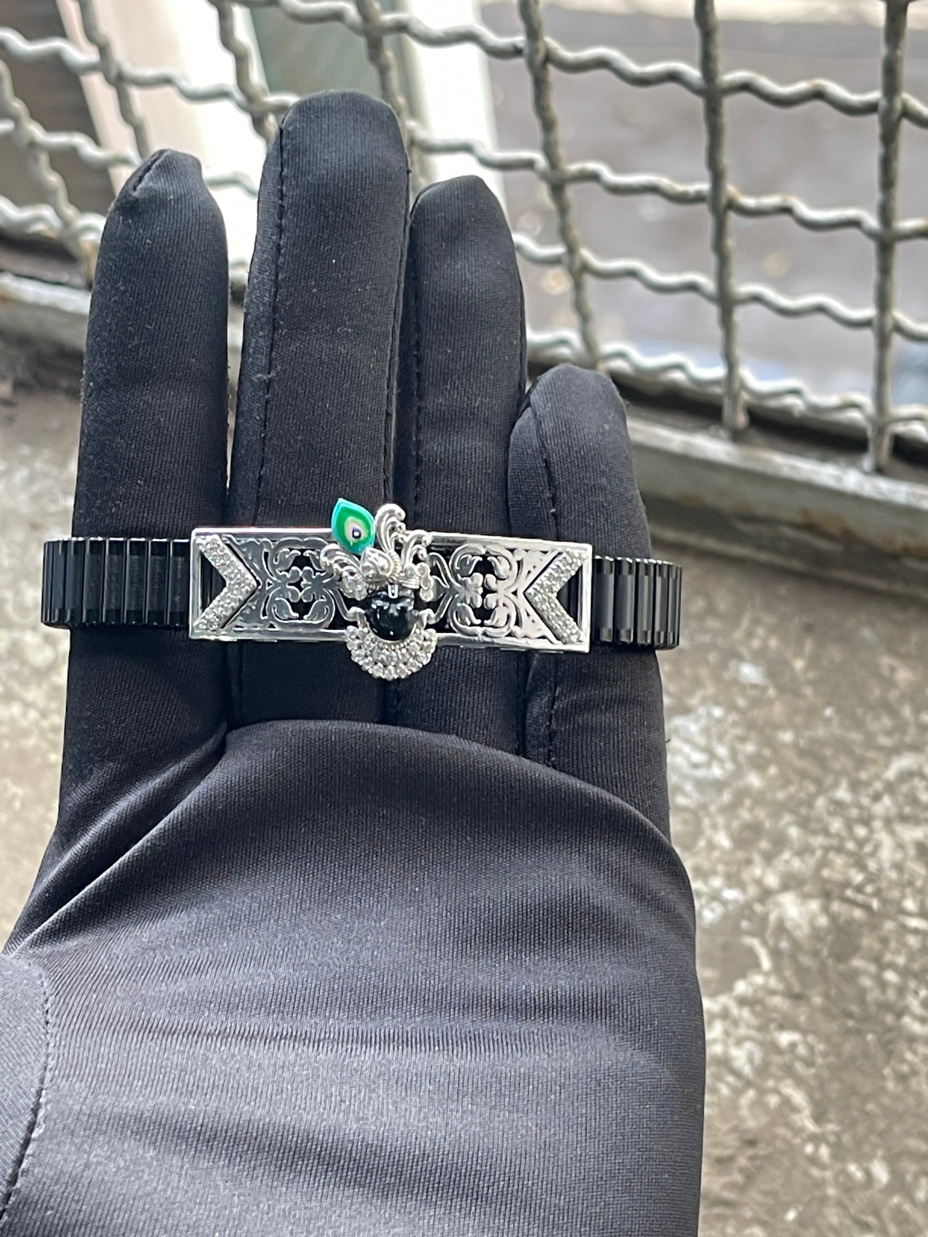 The 925 Silver Shrinathji Bracelet worn on a wrist, displaying its adjustable stainless steel spring belt kada design.
