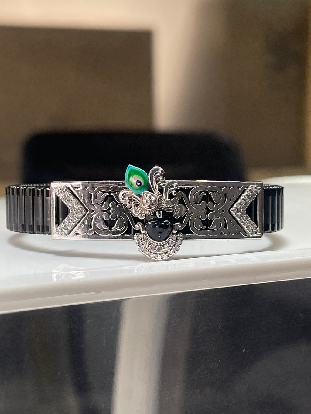 Front view of the Alankar 925 Silver Shrinathji Bracelet, highlighting the colorful Meena enamel work on the central motif.