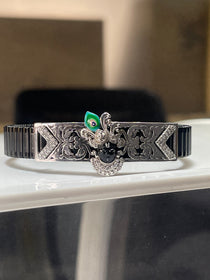 Front view of the Alankar 925 Silver Shrinathji Bracelet, highlighting the colorful Meena enamel work on the central motif.