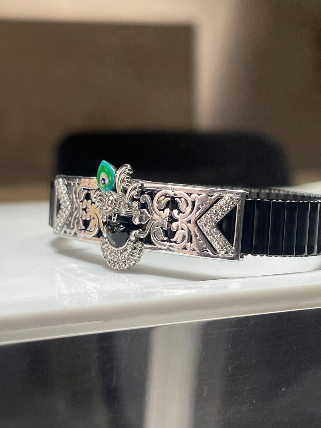 Angled perspective of the 925 Silver Shrinathji Bracelet, showing the sparkle of the embedded cubic zirconia stones.