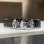 Front view of the Alankar Murugan Vel bracelet for men, showcasing the intricate silver-plated Vel design on the black band.