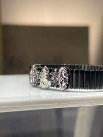 Side profile of the Lord Kartikeya kada for men, showing the sleek adjustable black strap and silver-plated Murugan Vel