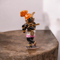 The back of the 925 sterling silver Radha Raman idol, showing the solid construction and beautiful finish of the sacred