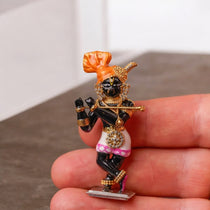 The 925 sterling silver Radha Raman idol shown with a measurement scale to indicate its 50 mm height for home temple decor.