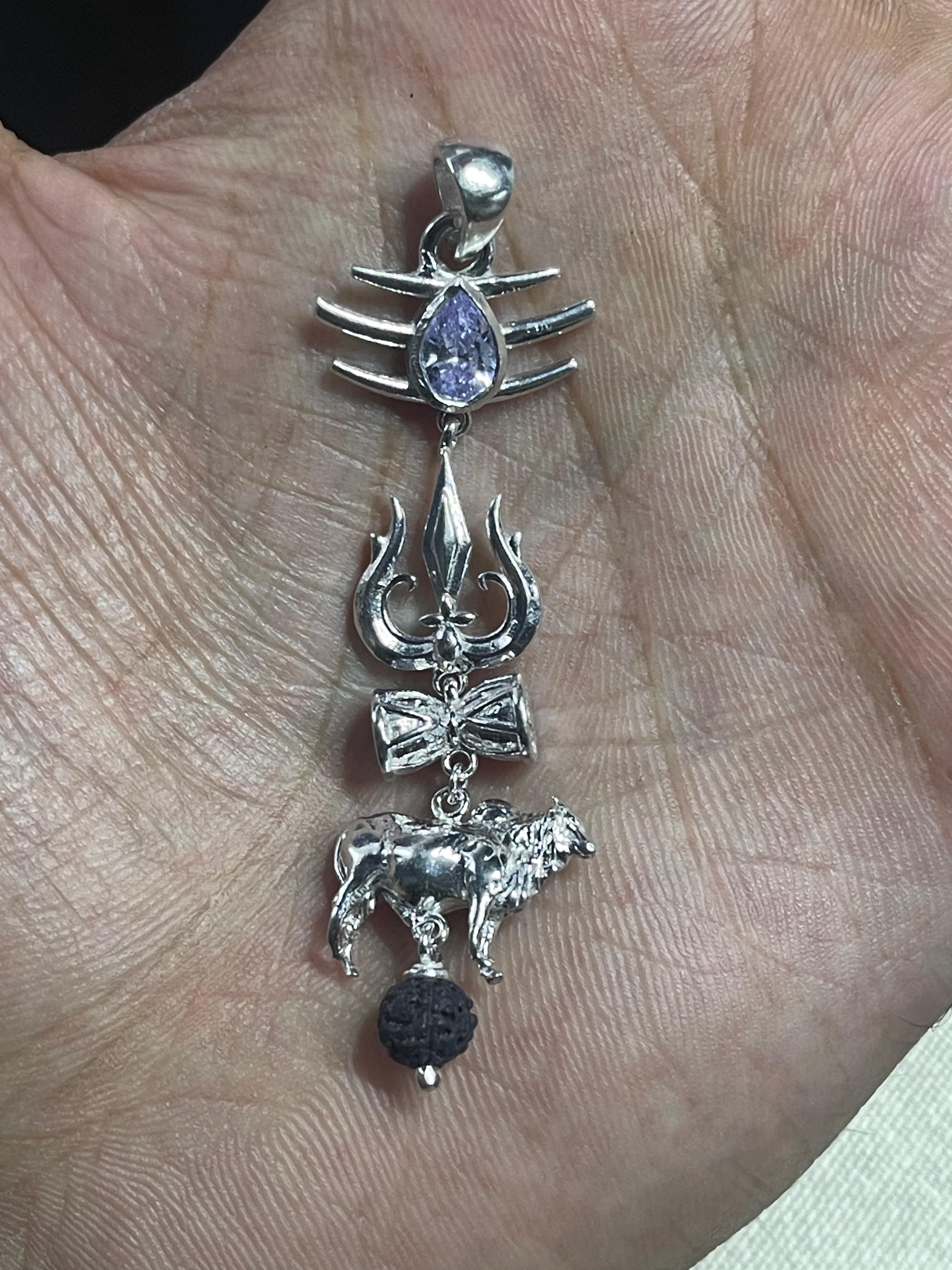 Angled view of the Mahakal spiritual pendant in 925 silver, showcasing the sacred Rudraksha bead and gemstone.