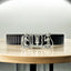 Front view of the 925 Silver Tirupati Balaji Tilak Bracelet on a black stainless-steel strap.