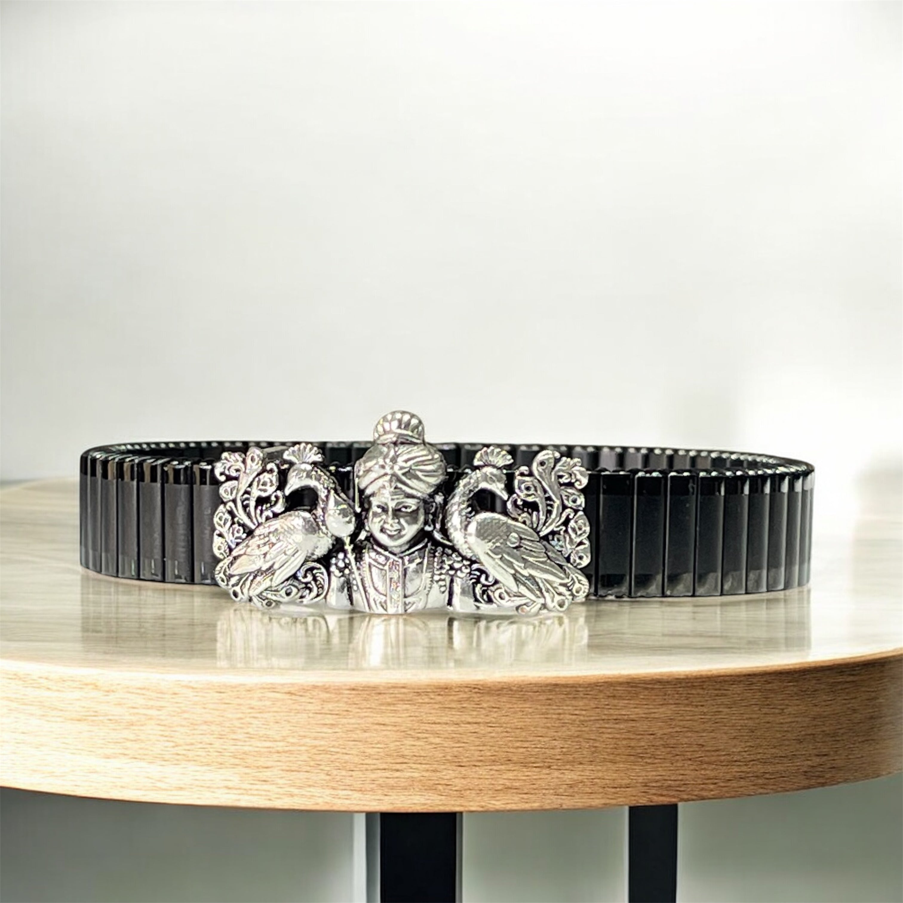Front view of the 925 silver Murugan Swami bracelet featuring detailed twin peacock motifs on a black strap.