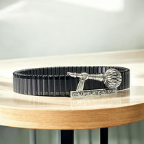 Side profile of the unisex 925 silver Hanuman Gada bracelet highlighting the secure black link strap.