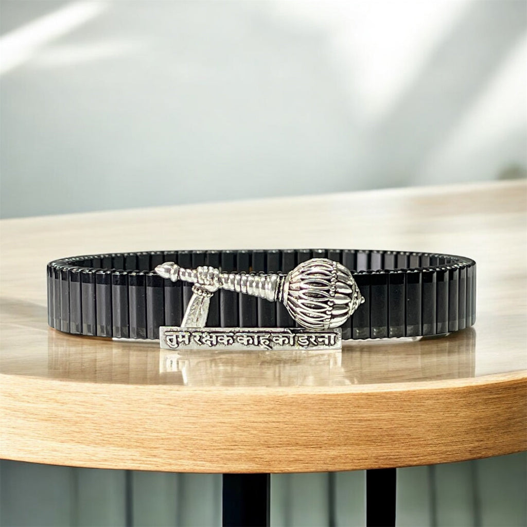 Front view of the 925 Silver Hanuman Gada Bracelet featuring an engraved mantra on a black steel strap.