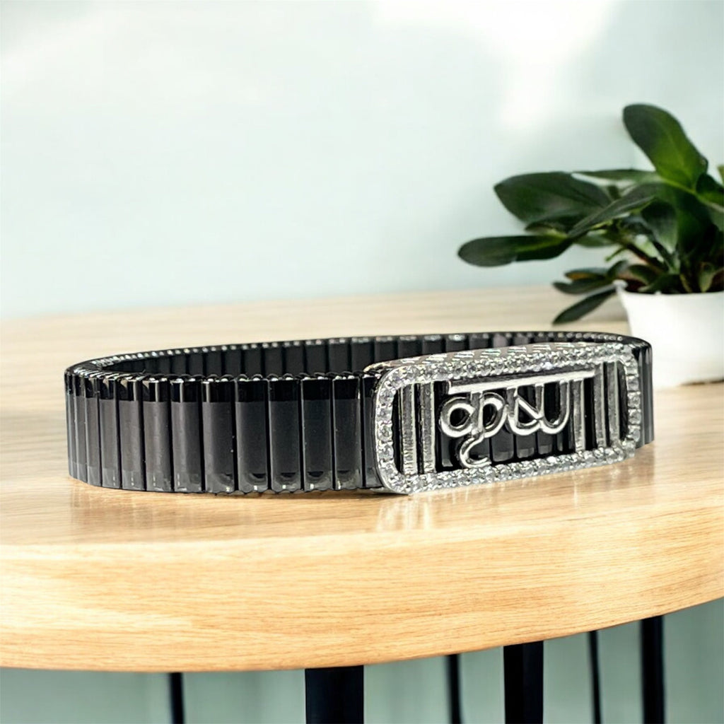 Side profile of the unisex 925 Silver Krishna Bracelet showing the secure fold-over clasp and black strap.