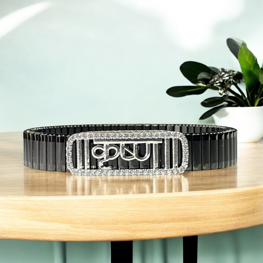 Front view of the 925 Silver Krishna Bracelet featuring stone-studded Hindi text on a black steel strap.