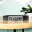 Front view of the 925 Silver Krishna Bracelet featuring stone-studded Hindi text on a black steel strap.