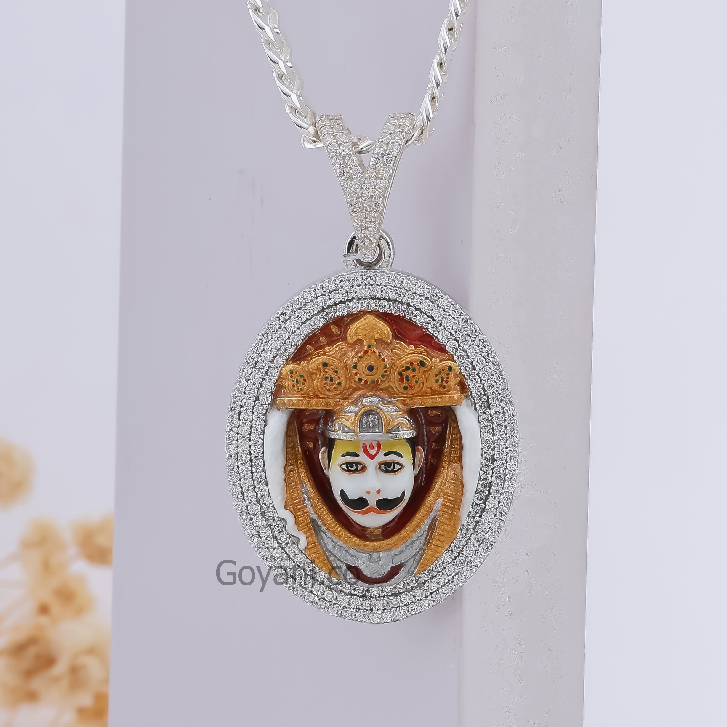 Close-up of the 925 silver Bhurakhiya Hanuman pendant highlighting the sparkling diamonds and colorful enamel.