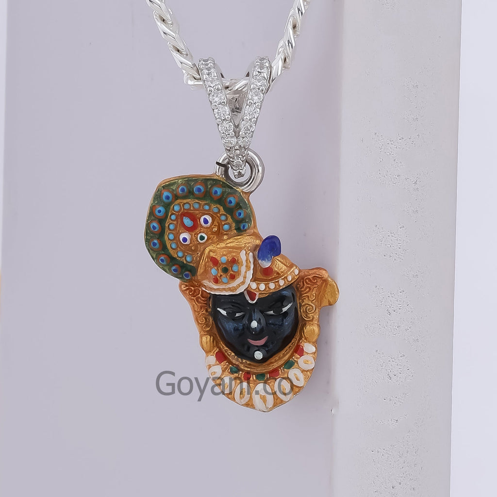 A detailed close-up of the Shrinathji Face Pendant in 925 silver, highlighting the vibrant colors of the enamel.