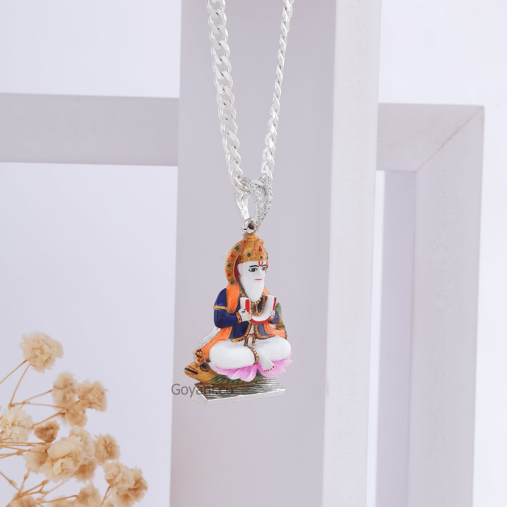 Angled shot of the Jhulelal Enamel 925 Silver Pendant, showcasing the craftsmanship and brilliant silver shine.