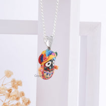 Angled shot of the Jagannath Enamel 925 Silver Pendant, highlighting its polished finish and spiritual design.