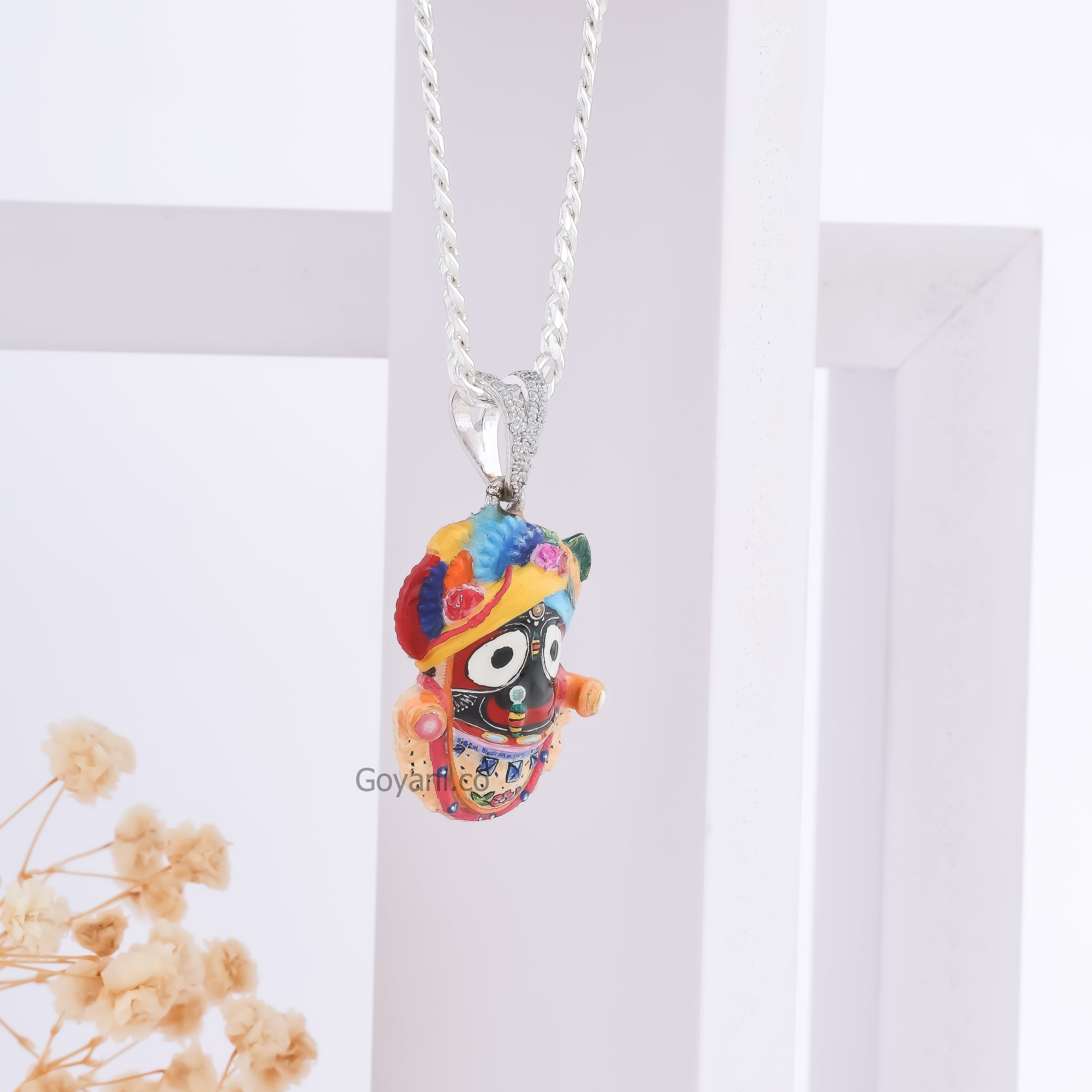 Angled shot of the Jagannath Enamel 925 Silver Pendant, highlighting its polished finish and spiritual design.