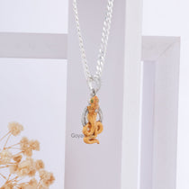 Angled profile of the handcrafted Gogaji Maharaj 925 silver pendant, showcasing its brilliant shine and elegant design.