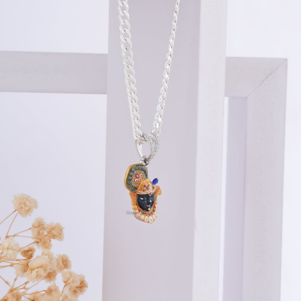 Angled view of the Shrinathji Face 925 Silver Pendant, showcasing its sterling silver shine and craftsmanship.
