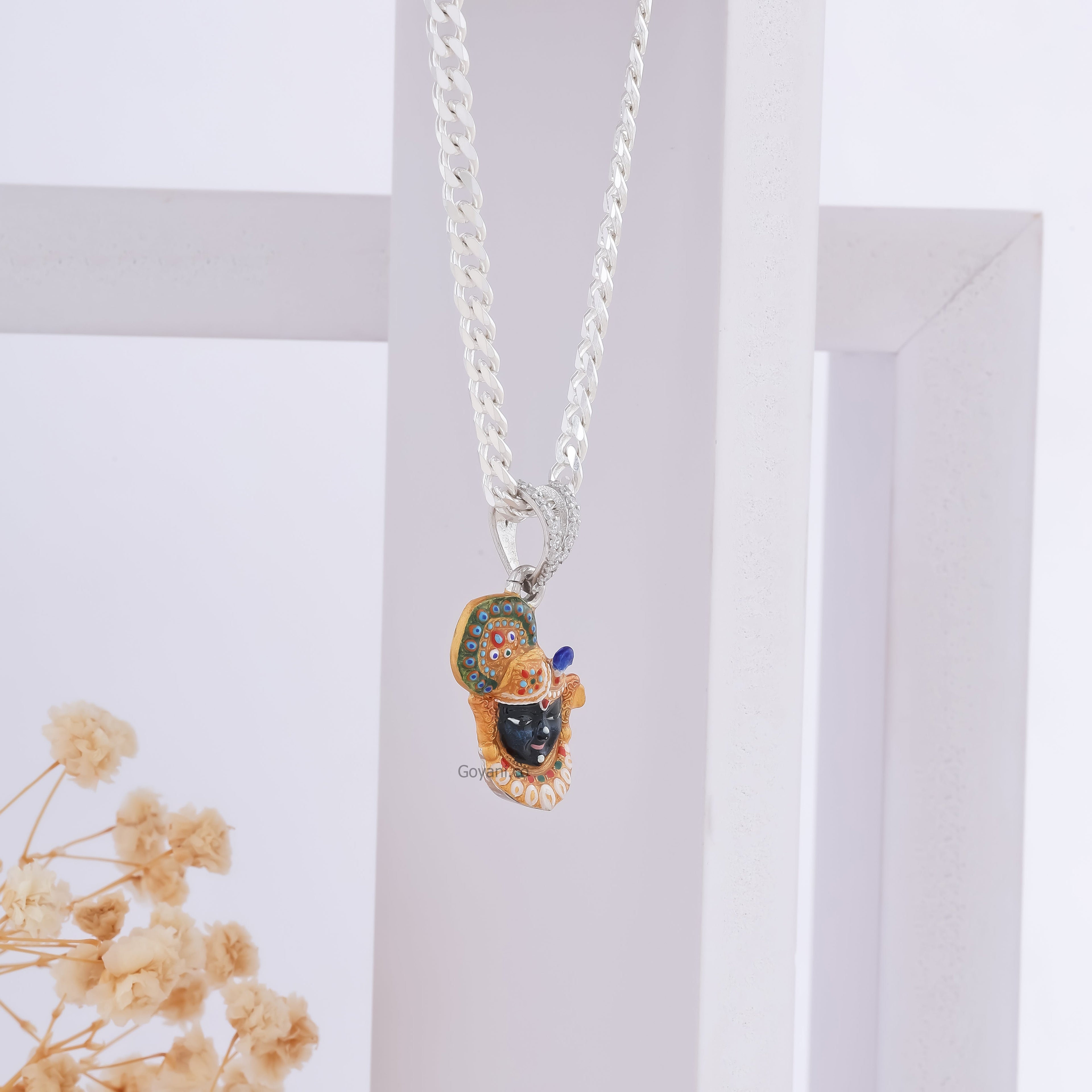 Angled view of the Shrinathji Face 925 Silver Pendant, showcasing its sterling silver shine and craftsmanship.