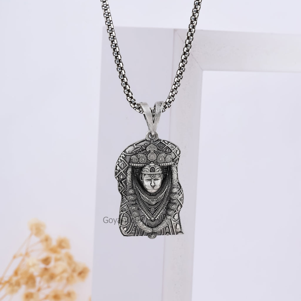The Bhurakhiya Hanuman pendant in 925 sterling silver on a neutral background, emphasizing its powerful design.