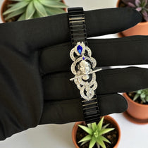 Front view of the Divine 925 Silver Krishna Bracelet with colorful enamel work, laid flat on a white surface.