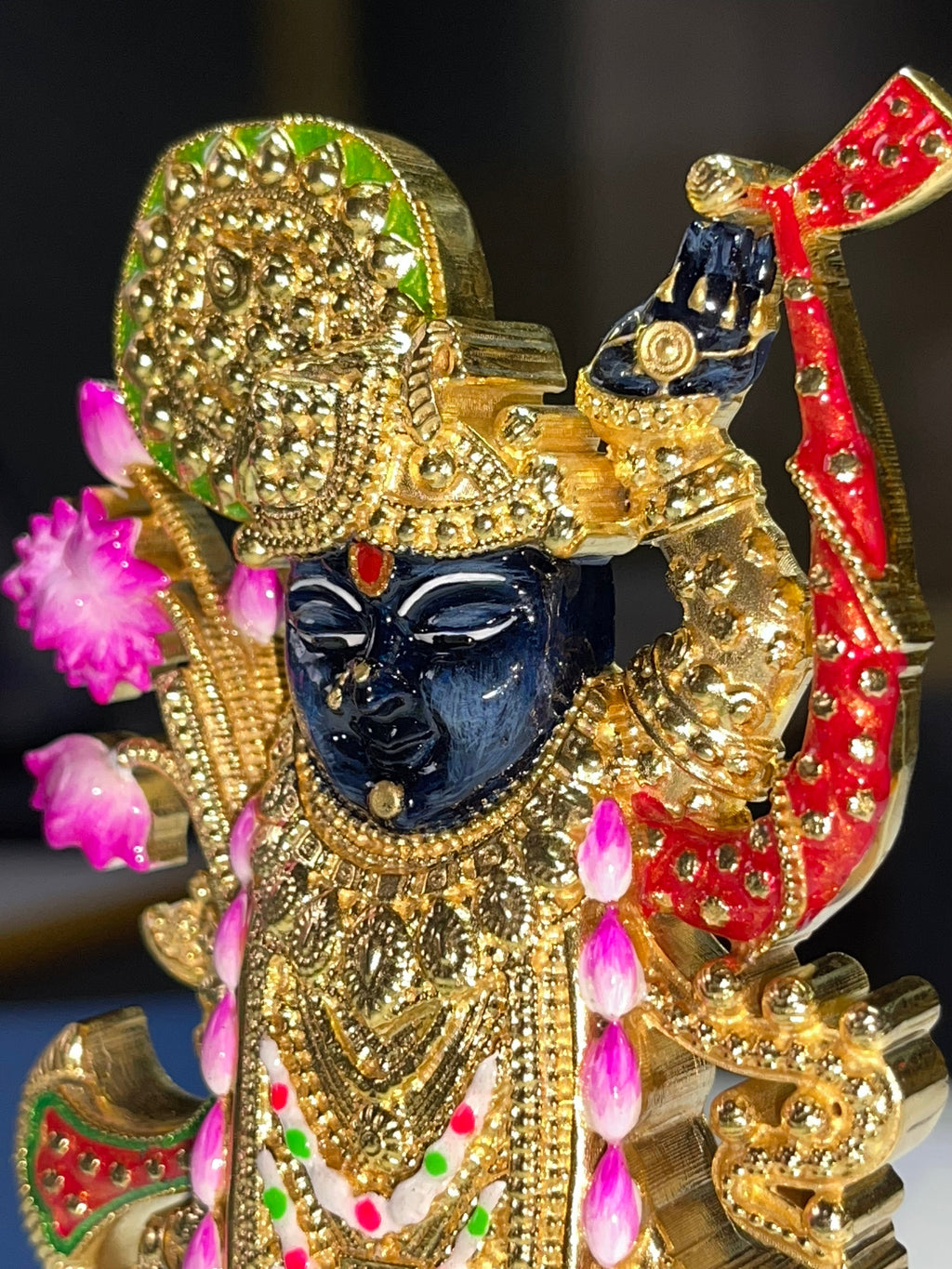 Close-up of the Shreenathji idol in pure 925 silver, highlighting fine facial features and mina details.