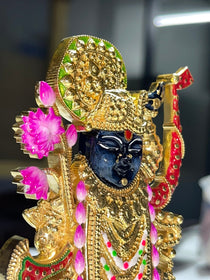 Side profile of the handcrafted 925 sterling silver Shreenathji Murti, showing the elegant gold finish.
