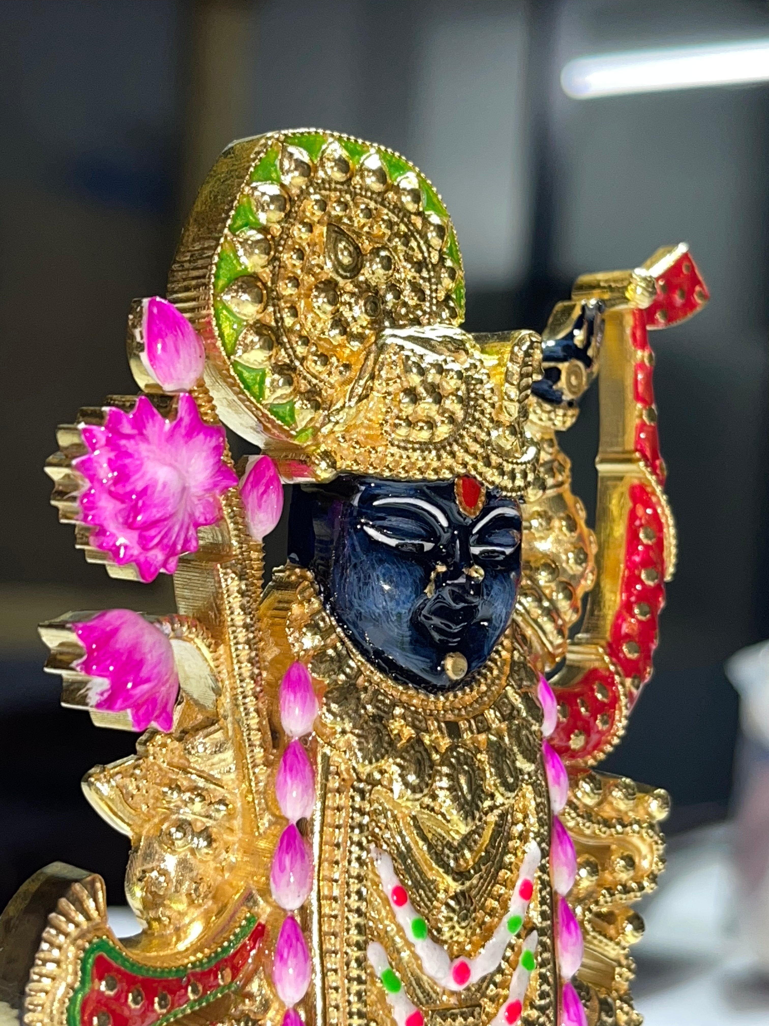 Side profile of the handcrafted 925 sterling silver Shreenathji Murti, showing the elegant gold finish.