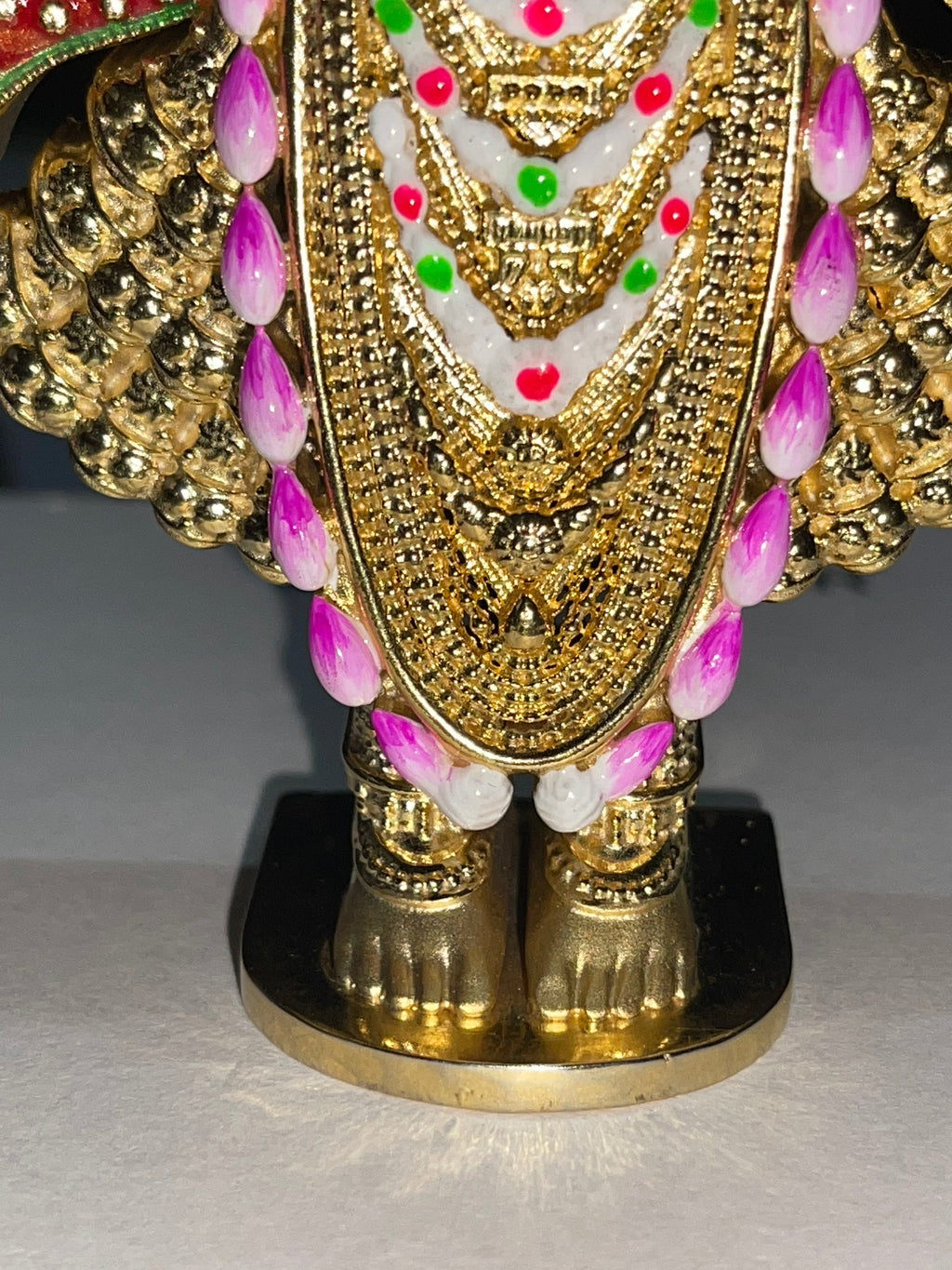 Back view of the Shreenathji silver idol featuring a sturdy jali support plate for perfect balance.