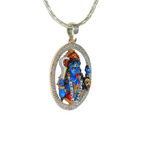Close-up detail of the divine Mahakali silver locket showing colorful enamel artistry and diamond accents.