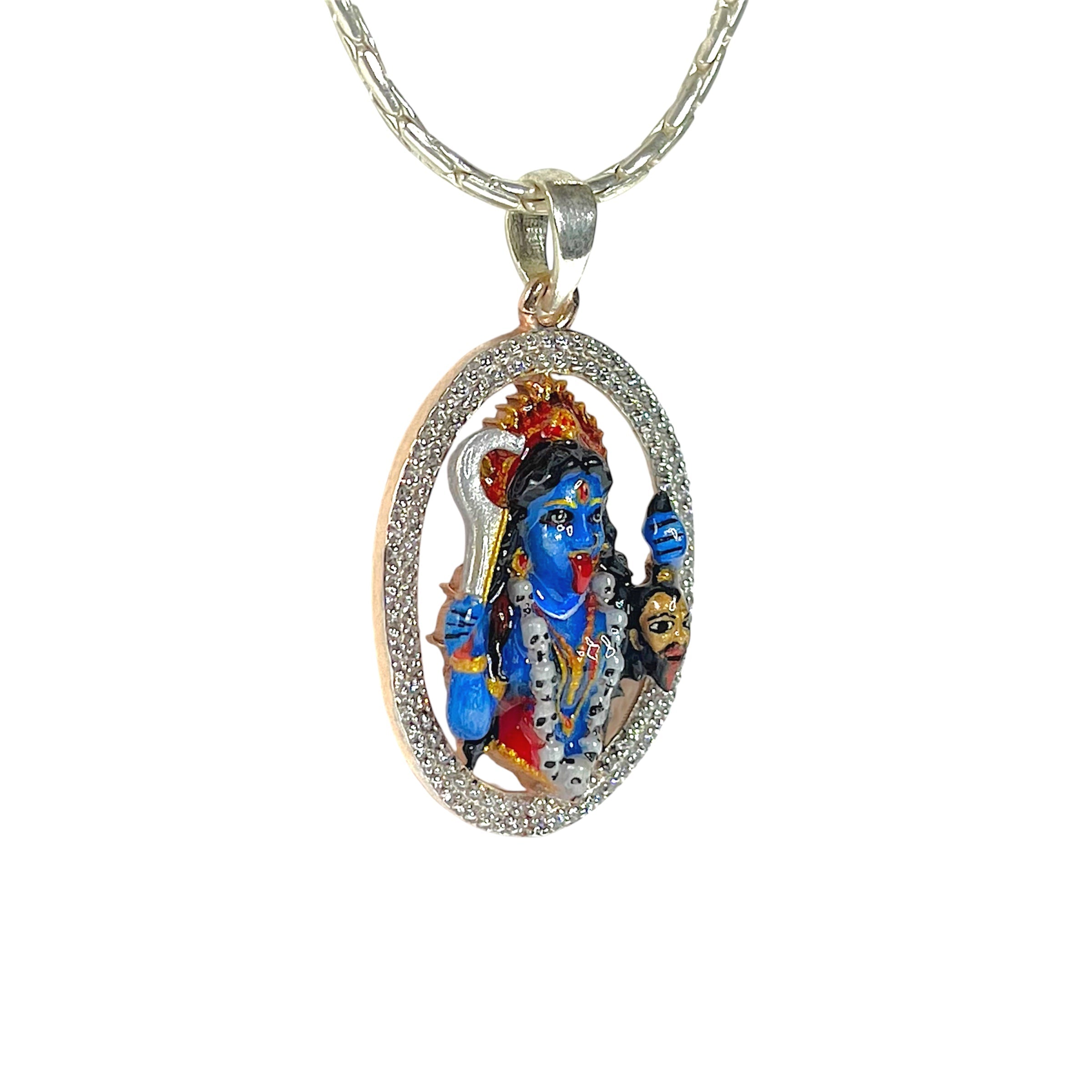Close-up detail of the divine Mahakali silver locket showing colorful enamel artistry and diamond accents.