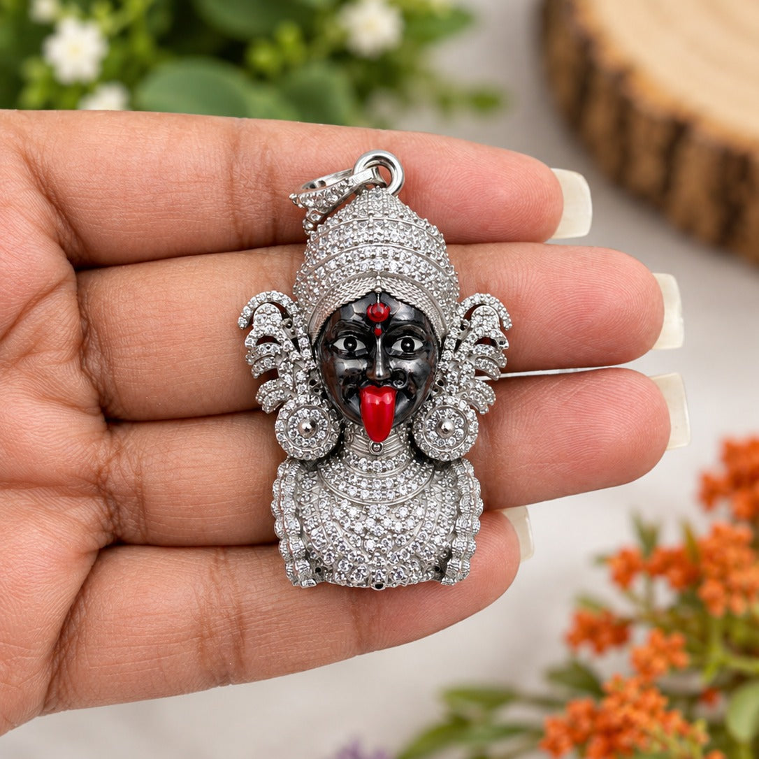 Jeweled Deity Pendant in Hand-crop.jpg
