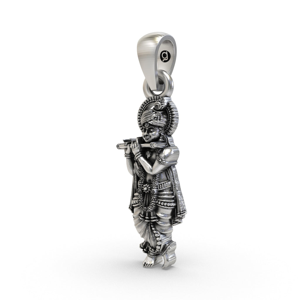 Angled side view of the sterling silver Krishna pendant showcasing its high-polish finish and craftsmanship.