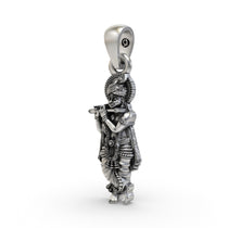 Angled side view of the sterling silver Krishna pendant showcasing its high-polish finish and craftsmanship.