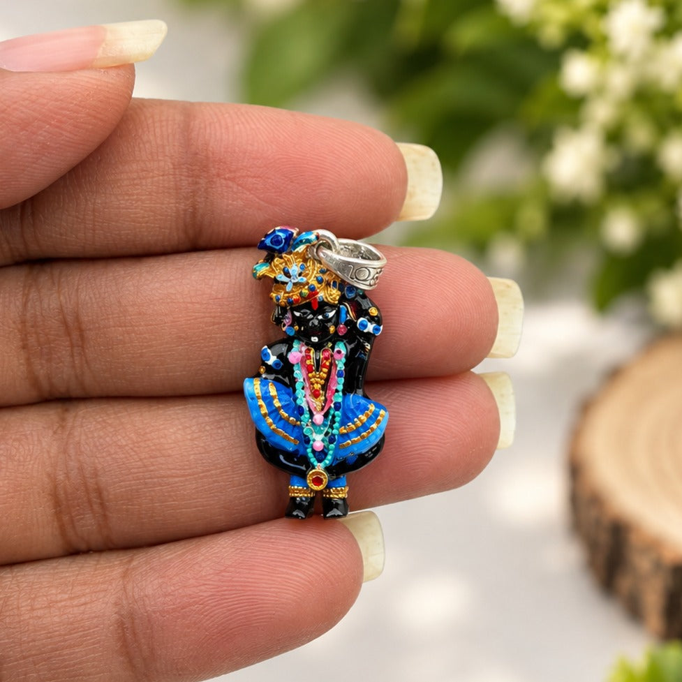 Ornate Colorful Deity Pendant in Hand-crop.jpg