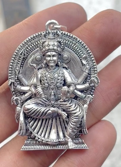 Kodungallur Bhagavathy Amma sterling silver pendant shown with a ruler for size and scale reference.