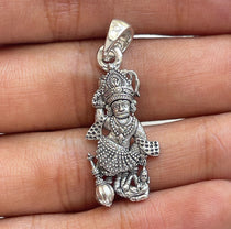 Lifestyle image of the Salangpur Hanumanji 925 silver pendant being worn to show its scale and appearance.