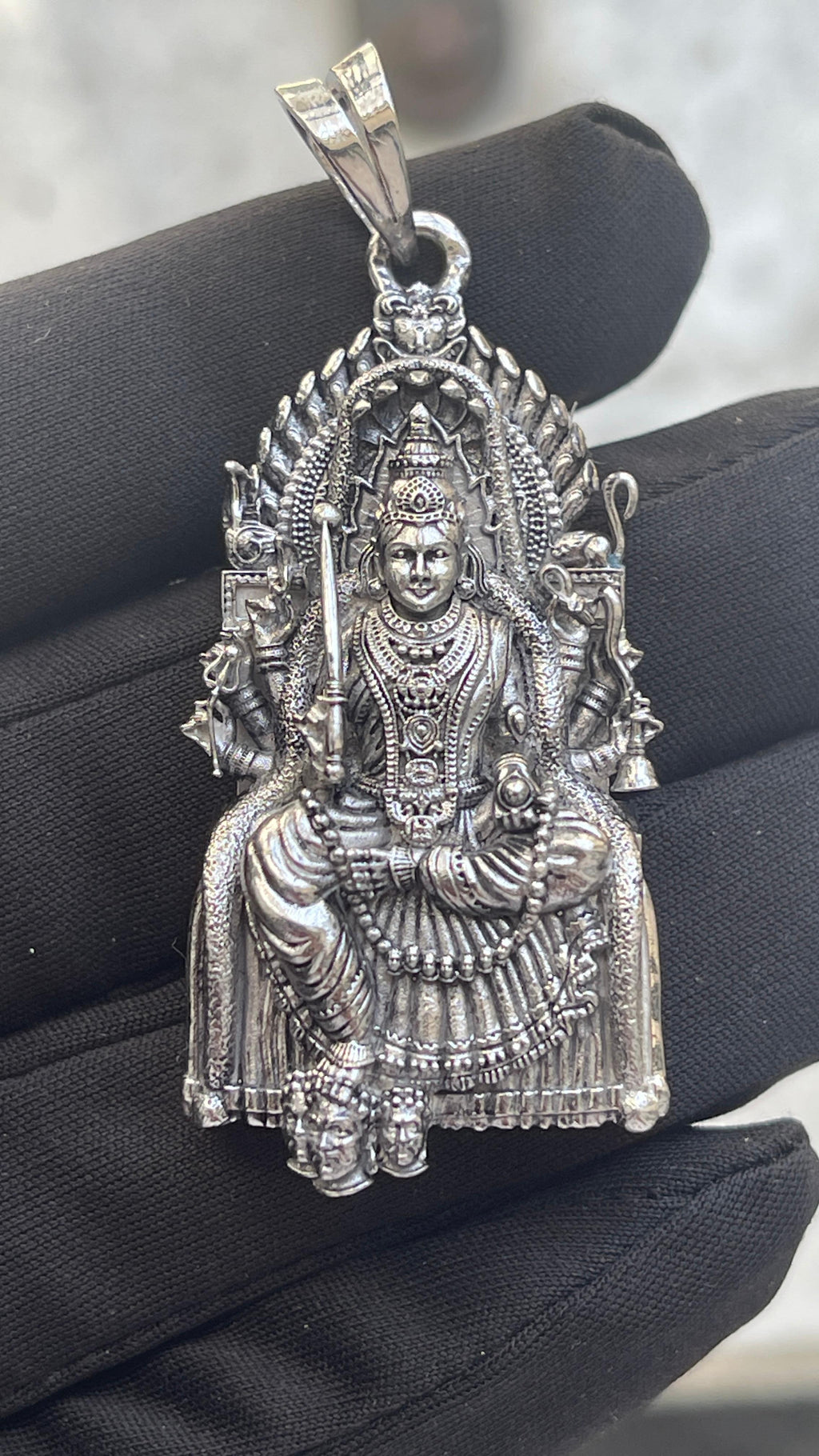 A model wearing the elegant 925 silver Samayapuram Mariamman locket to show its scale and daily wear style.