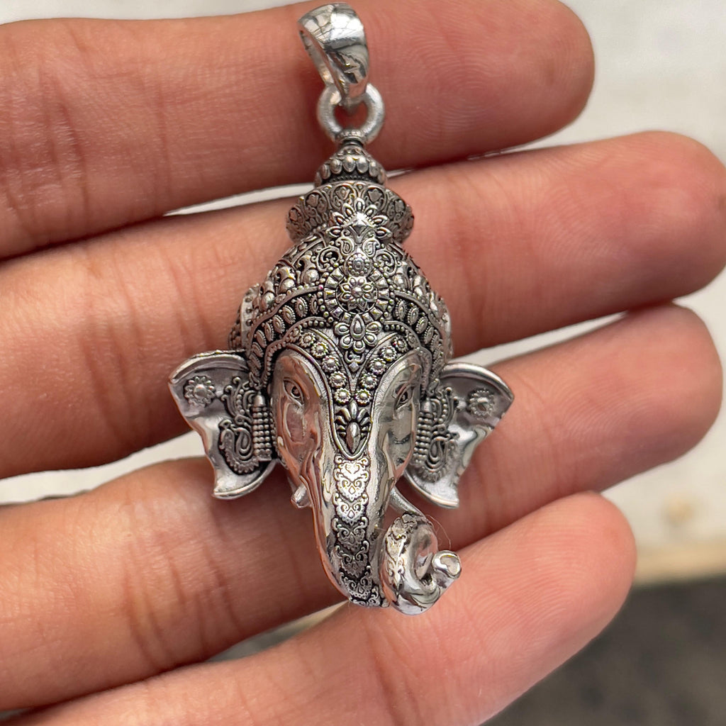 The 925 Silver Ganpati Face Pendant displayed on a surface to showcase its 40mm size and authentic oxidized silver look.