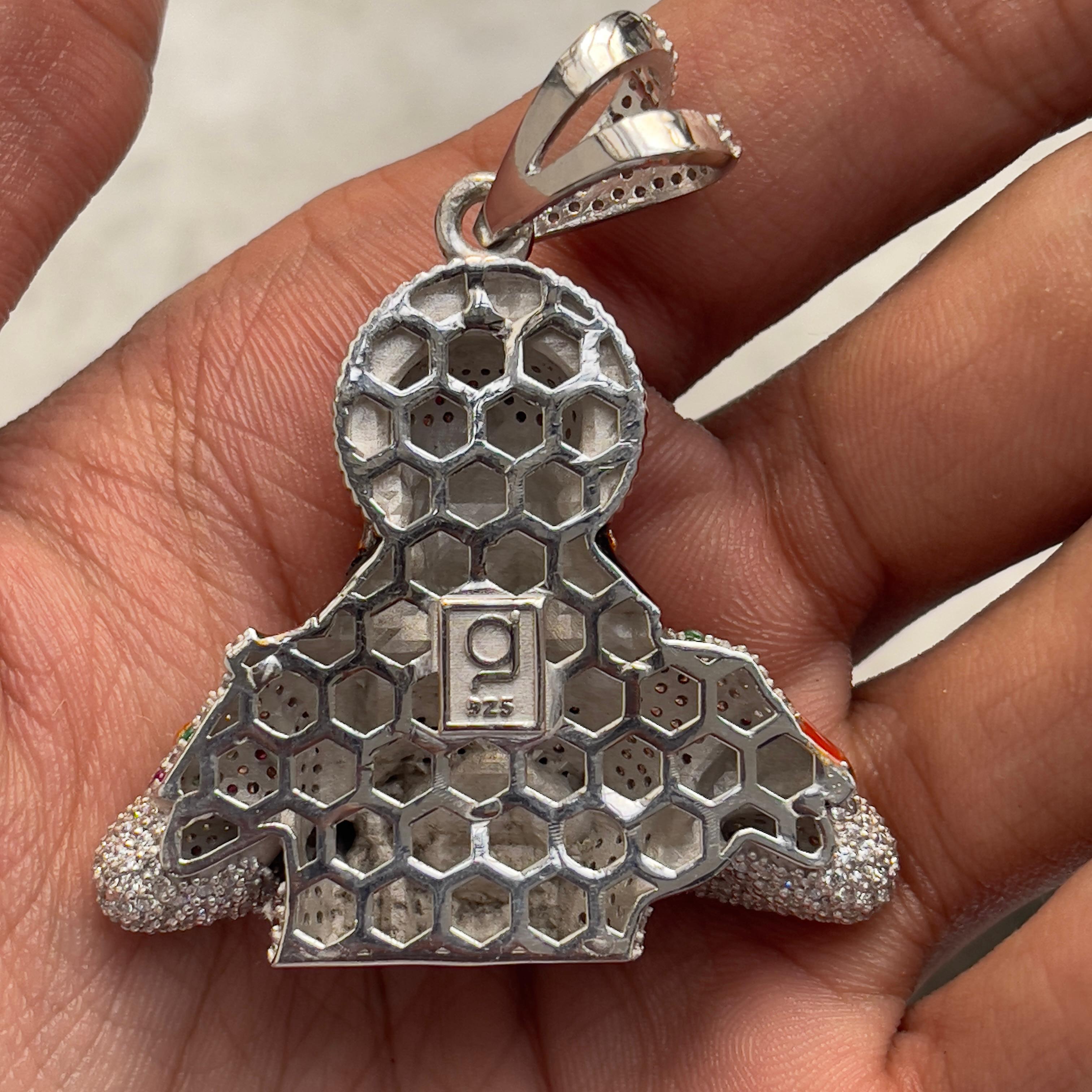 The iced out Hanumanji pendant on a silver chain, demonstrating how the hip hop style jewelry piece looks when worn.