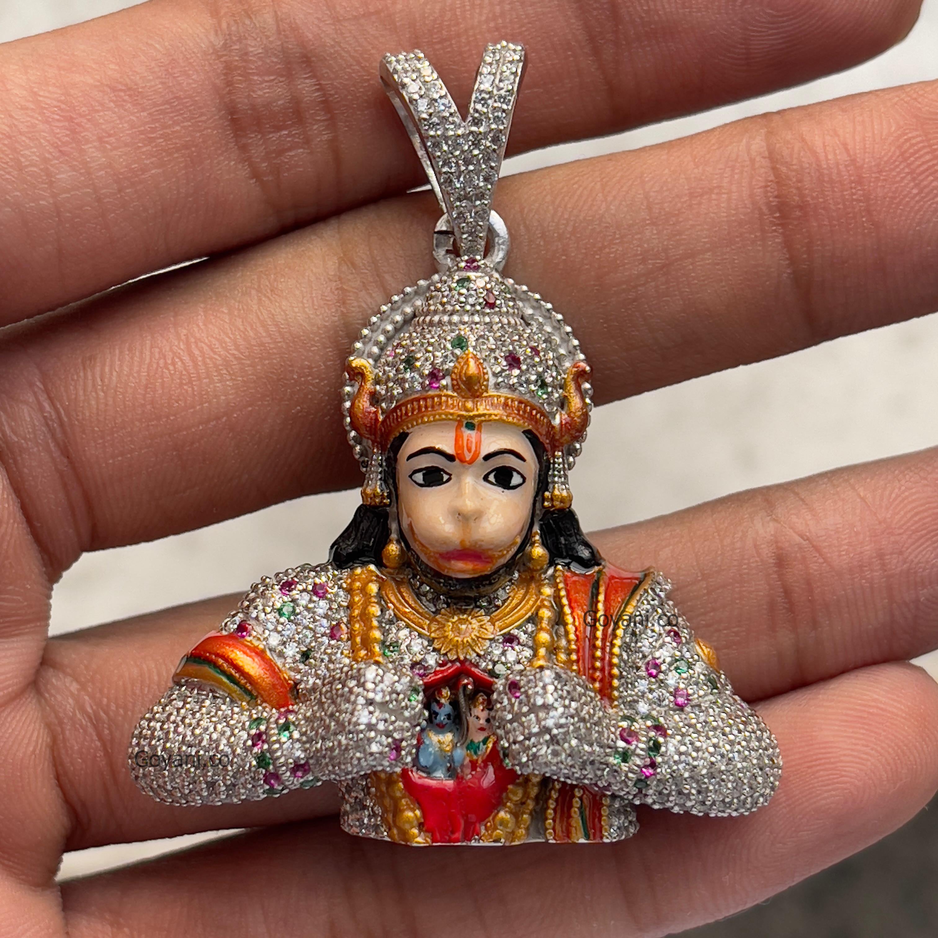 An angled perspective of the 925 silver Hanumanji pendant, highlighting the sparkling diamonds and detailed Mina work.