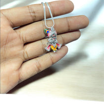 Close-up of the sterling silver Bal Gopal pendant showing the intricate enamel work and brilliant-cut stones.